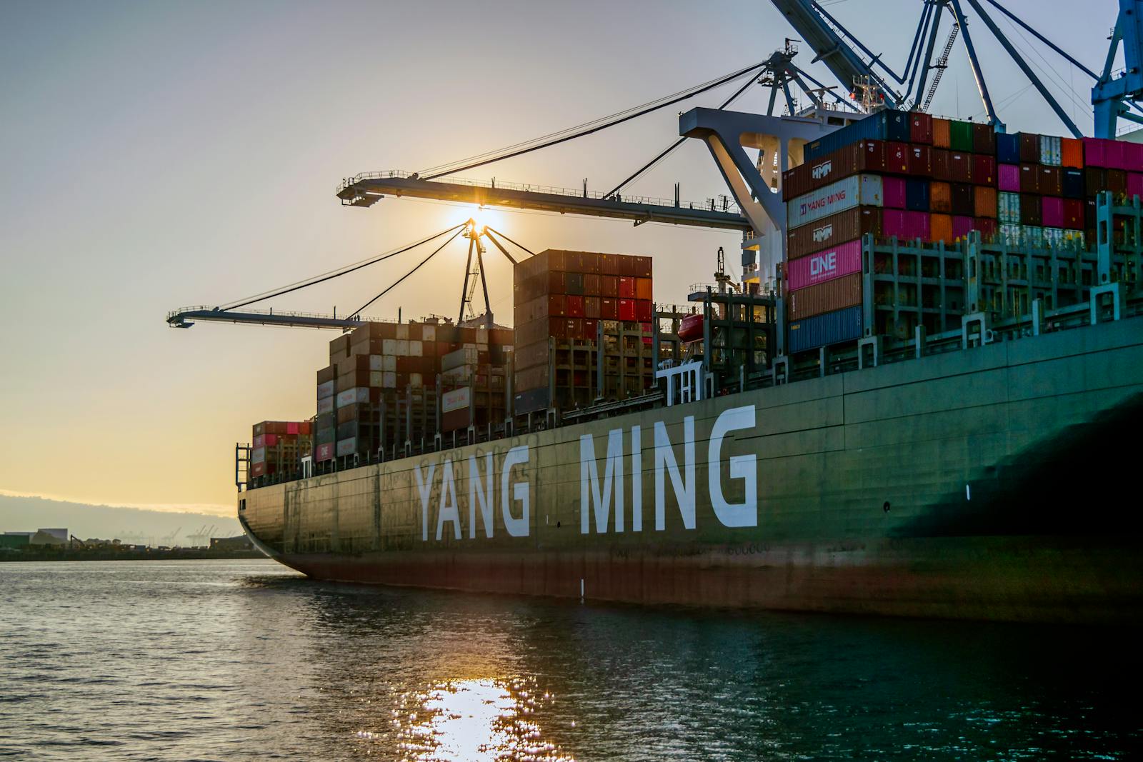 Container ship loaded with cargo containers at a shipping port