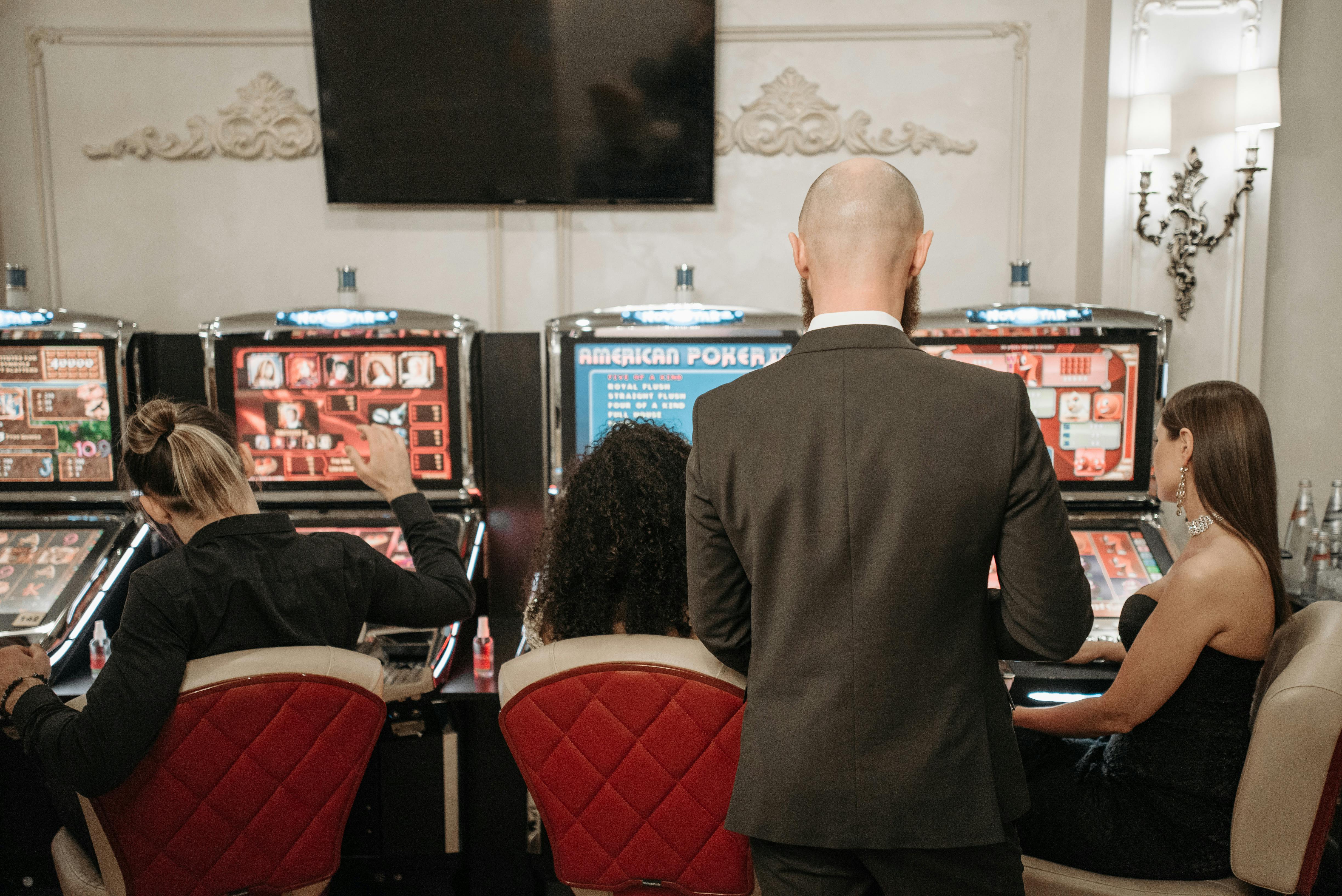 Casino floor with players and slot machines