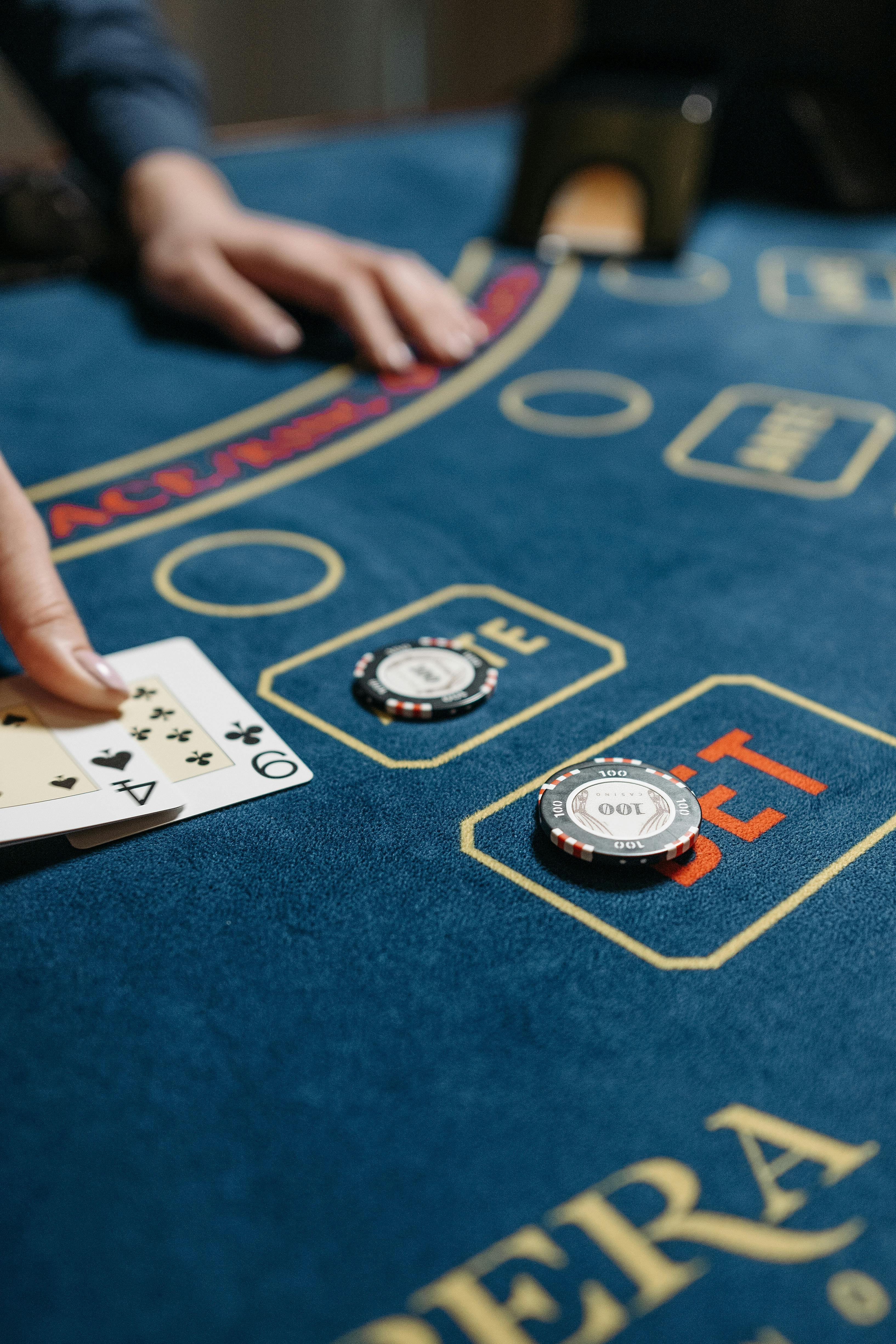 Casino chips and cards on table during active gameplay
